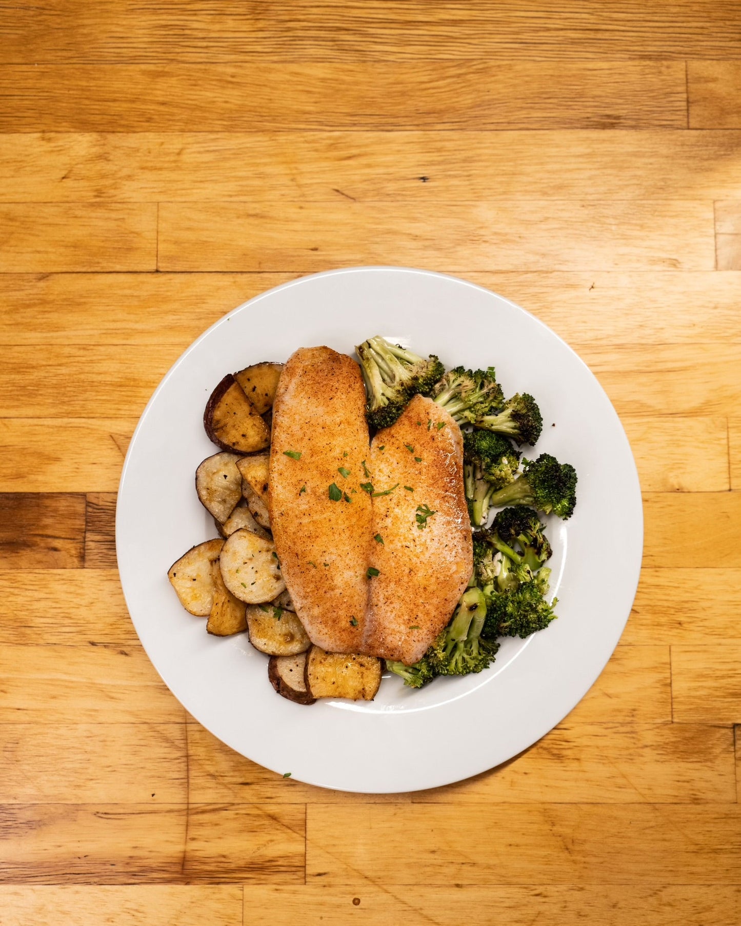 5 oz Cajun Tilapia, Roasted Red Potatoes, and Broccoli